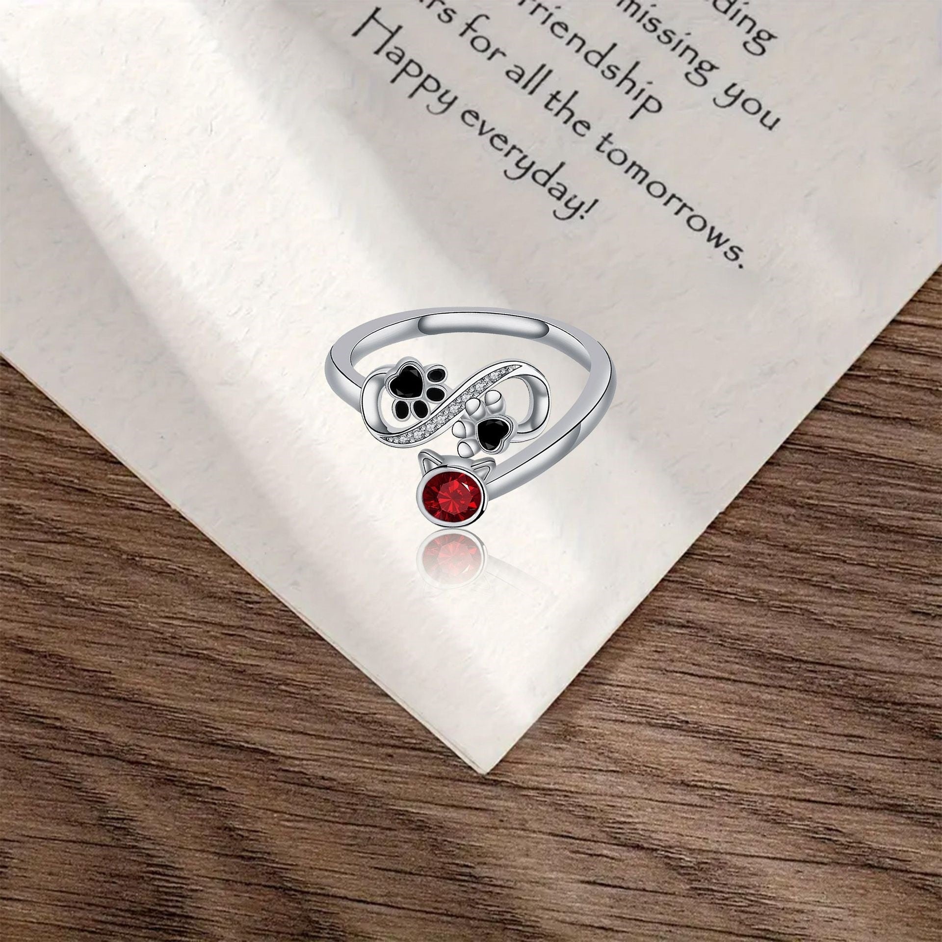 Adjustable Ring with Black Paw Print and Red Gemstone